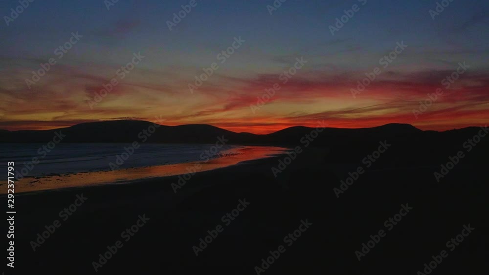 Slow panning left of an incredible sunset at the beach on Irish coast Slow panning left of an incredible sunset at the beach on Irish coast