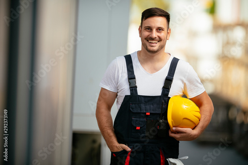 Portrait of young worker in uniform