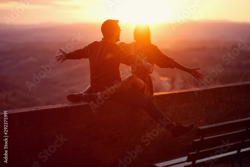 Lovers. romantic at sunset. Couple enjoying together. photo