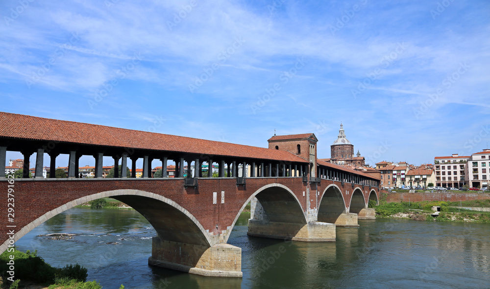 view of Old Bridge in Pavia City in Italy and the Ticino River