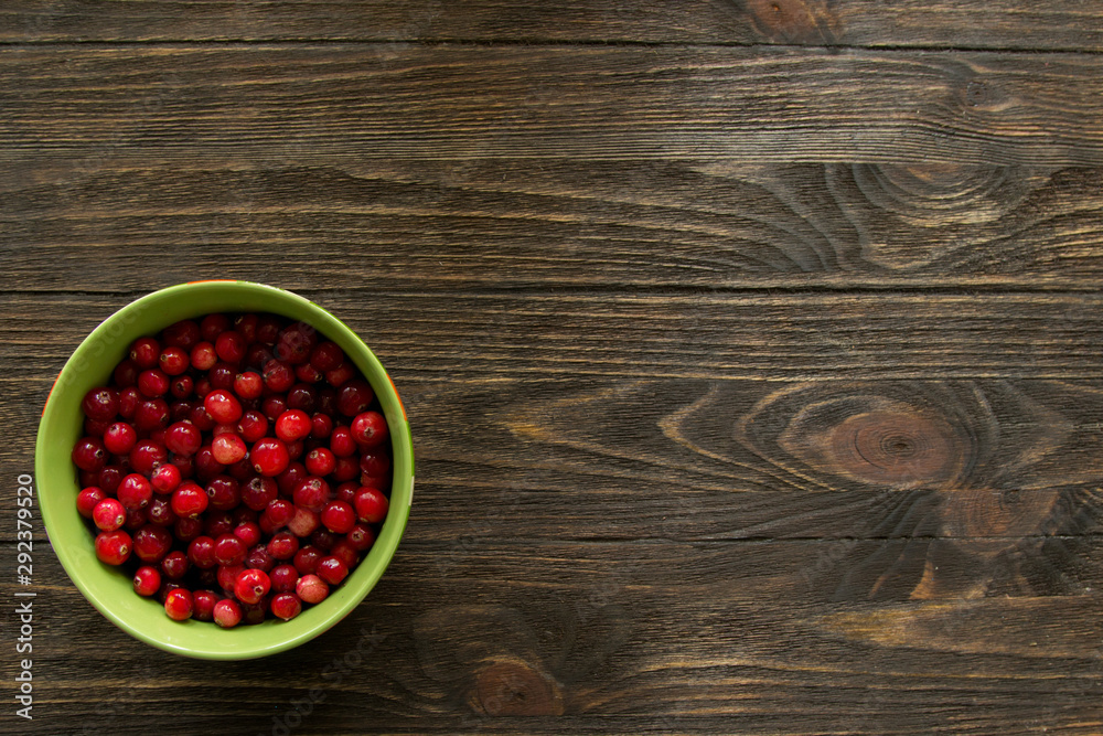 red cranberries on a wooden table, cranberries vitamins red cranberries on a wooden table, cranberries vitamins