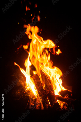 Bright fire. Hot bonfire. Photo background with fire, flames closeup. Bonfire on the street.
