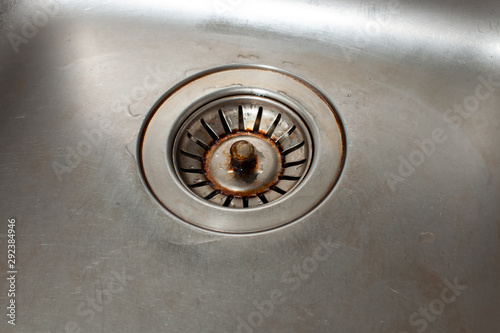 Dirty drain cover in dishwashing the metal sink