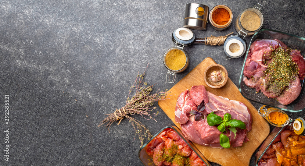 banner of raw meat with herbs , spices, sauces on concrete background. Top view, flat lay banner of raw meat with herbs , spices, sauces on concrete background. Top view, flat lay