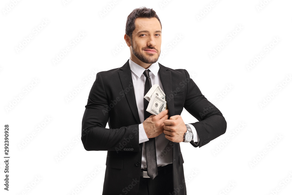 Businessman putting money in his suit pocket Businessman putting money in his suit pocket