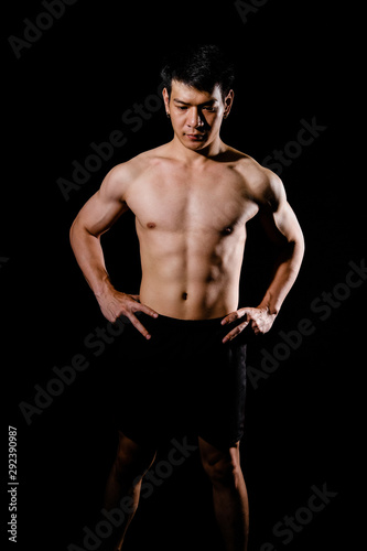 athletic muscular bodybuilder man with naked torso six pack abs. fitness workout concept