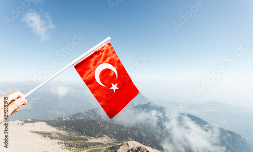 Flag of Turkey against the backdrop of Taurus Mountains