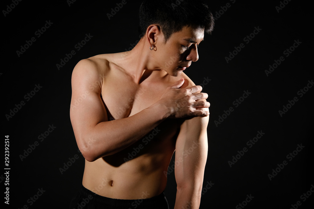 athletic muscular bodybuilder man with shoulder pain. fitness workout injury concept athletic muscular bodybuilder man with shoulder pain. fitness workout injury concept