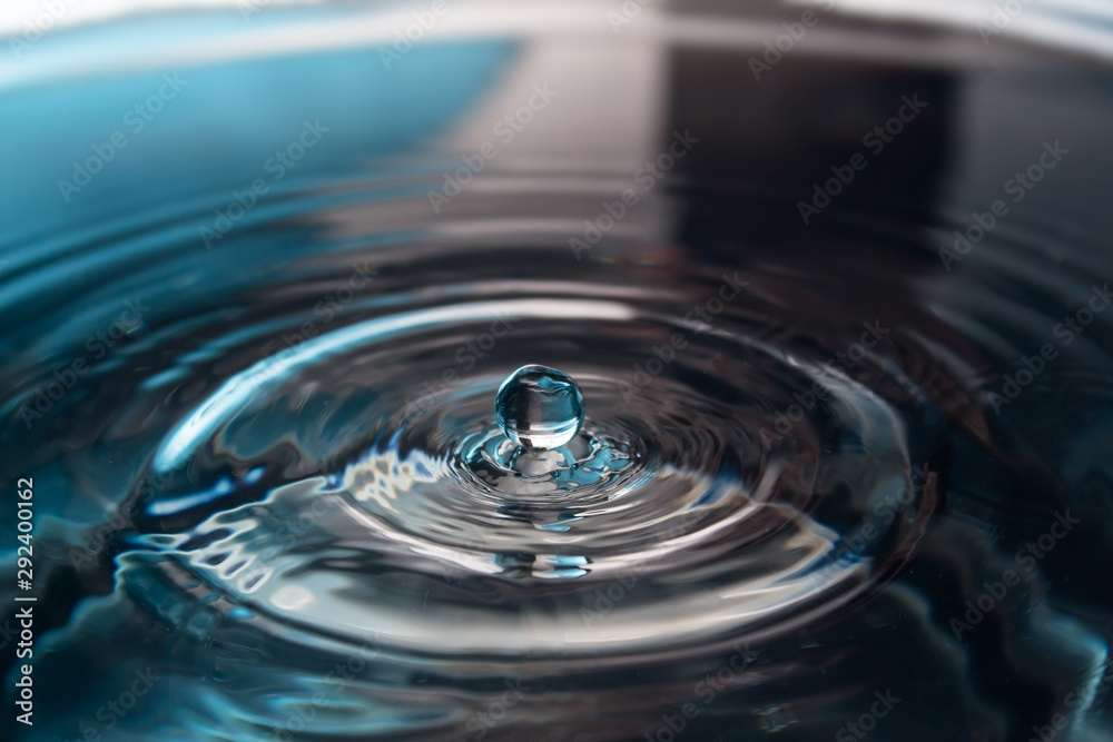 Water splash or drop. Water splash close-up. Blue water drop. Falling water Water splash or drop. Water splash close-up. Blue water drop. Falling water