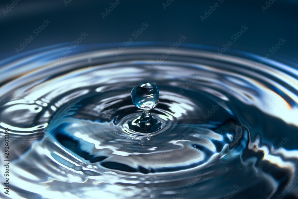 Water splash or drop. Water splash close-up. Blue water drop. Falling water Water splash or drop. Water splash close-up. Blue water drop. Falling water