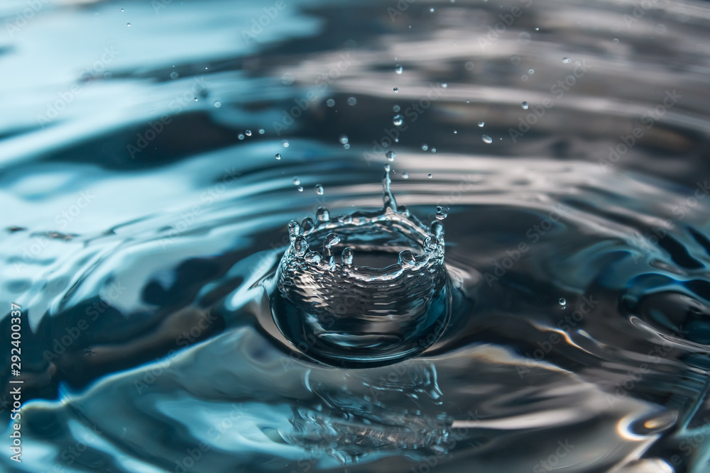 Water splash or drop. Water splash close-up. Blue water drop. Falling water Water splash or drop. Water splash close-up. Blue water drop. Falling water