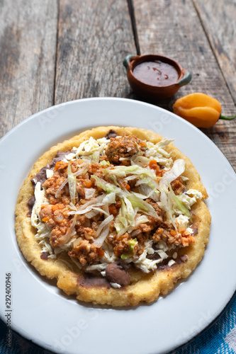 Mexican food: sopes of Picadillo beef with cheese and beans