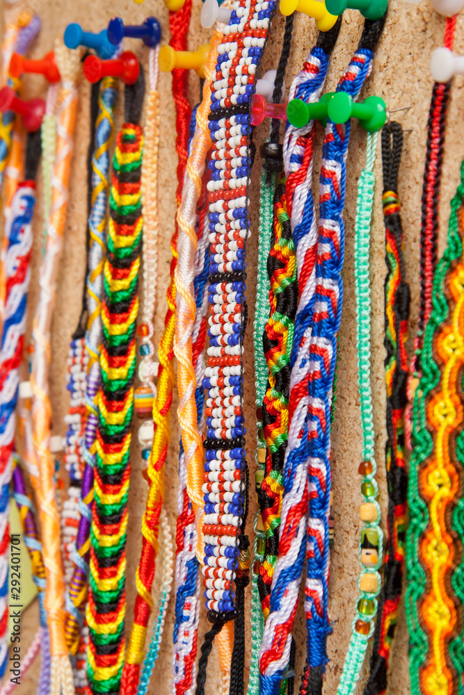 Bracelets hanging on a stall in a market. Bracelets hanging on a stall in a market.