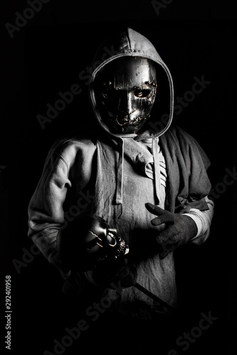 man in halloween costume of ghost evil with black metal mask and wear  hooded in darkness concept Stock Photo | Adobe Stock
