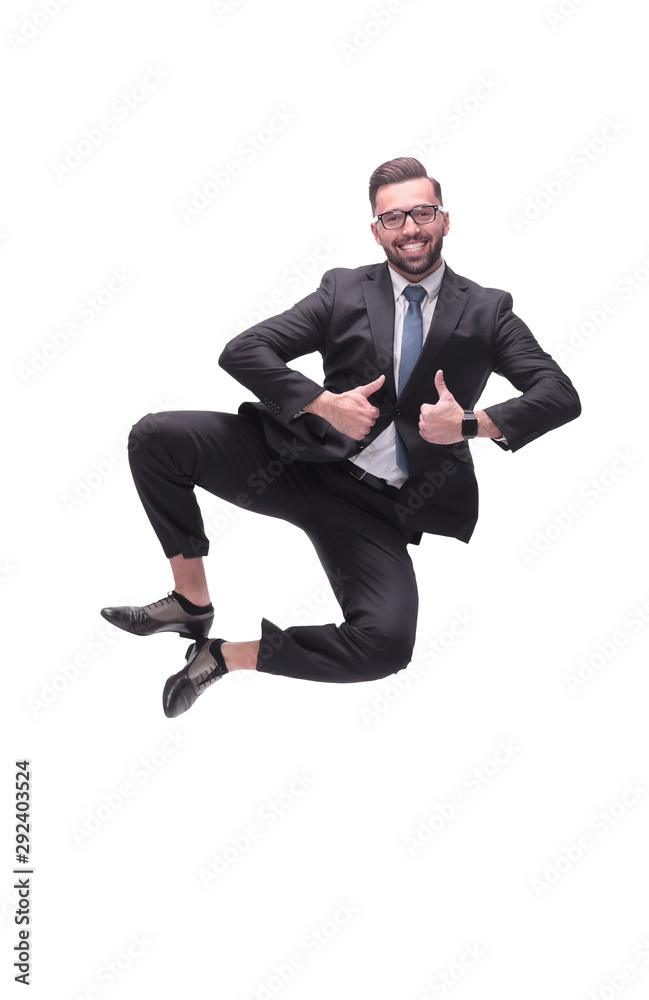 in full growth. happy dancing young businessman in full growth. happy dancing young businessman
