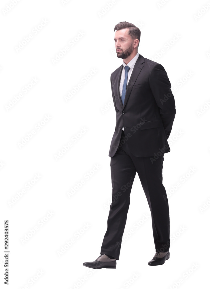 rear view. pensive businessman stepping forward . isolated on white rear view. pensive businessman stepping forward . isolated on white