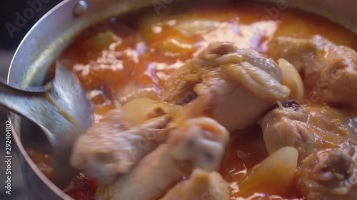 Making of Massaman Curry. Stir by woman. Close up. Muslim food. Asian food.