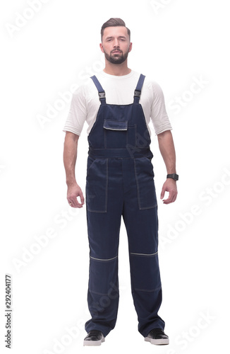 confident young man in blue overalls . isolated on white © ASDF