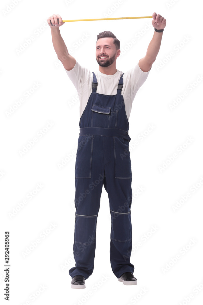 in full growth. smiling man showing construction - roulette in full growth. smiling man showing construction - roulette