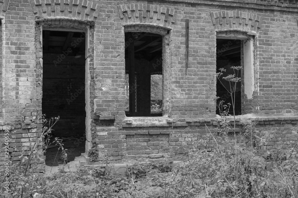 Ruins, old, brick, abandoned house. black-and-white photo.