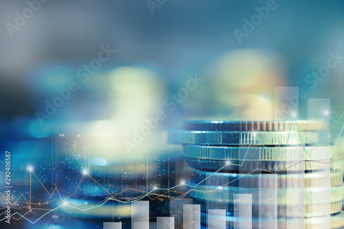 Financial investment concept  Double exposure of stack of coins and city for finance investor  Forex trading market candlestick chart  Cryptocurrency Digital economy. investing growing.