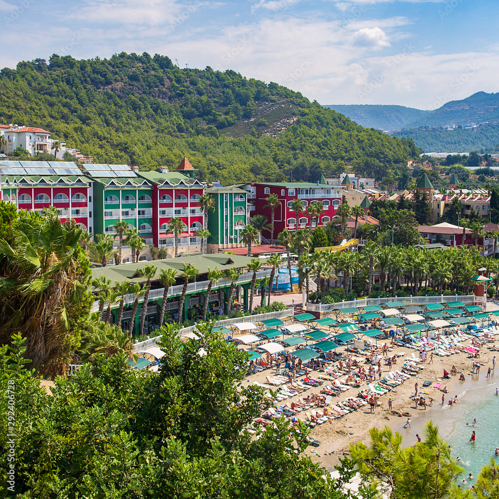 Kanakly, Alanya, Turkey - April 24, 2019: Sunny Alanya beach in Turkey with sea view. View from the fortress on the mountain. Mediterranean Sea