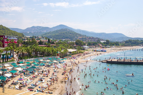 Fototapeta Naklejka Na Ścianę i Meble -  Kanakly, Alanya, Turkey - April 24, 2019: Sunny Alanya beach in Turkey with sea view. View from the fortress on the mountain. Mediterranean Sea