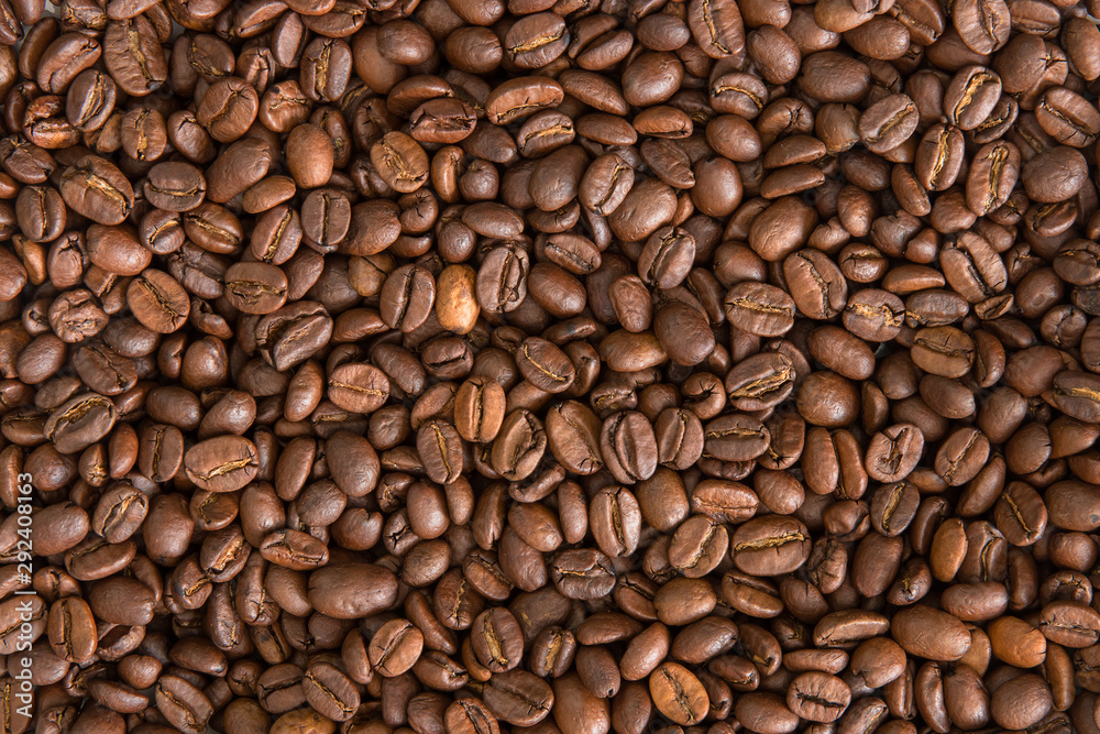 Roasted coffee beans background. Flat lay composition of coffee mood concept Roasted coffee beans background. Flat lay composition of coffee mood concept