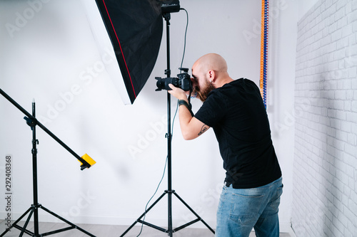 an photographer with camera in studio