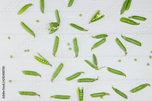Food photography. Peas scattered on a white board