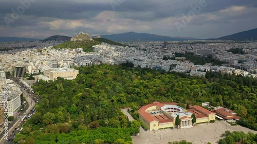 Aerial video taken by drone of iconic public Zappeio hall used for events and lycabettus hill at the background , Athens historic centre, Attica, Greece photo