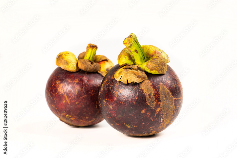 Fototapeta premium Two mangosteen fruits isolated on white background