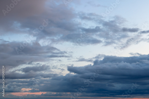 Tableau sur toile Beautiful dark sky at sunset with cumulus clouds after rain