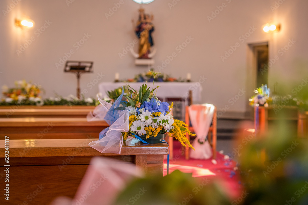 Flowers and other wedding decoration in a church