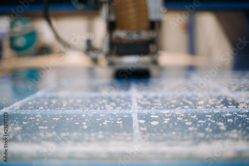 Fotografi Milling cutter cuts plastic part on robotized production line