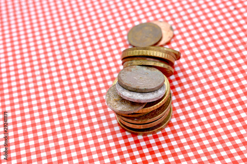 coins on red stripped background photo