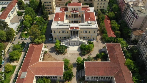 Aerial drone video of iconic public neoclassic National Technical University of Athens and National Archaeological museum in the heart of Athens, Attica, Greece photo