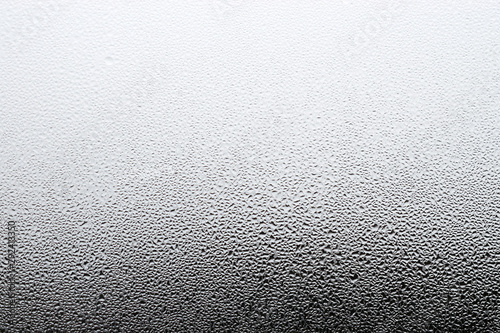 Steamy window background. Drops of condensate on the glass