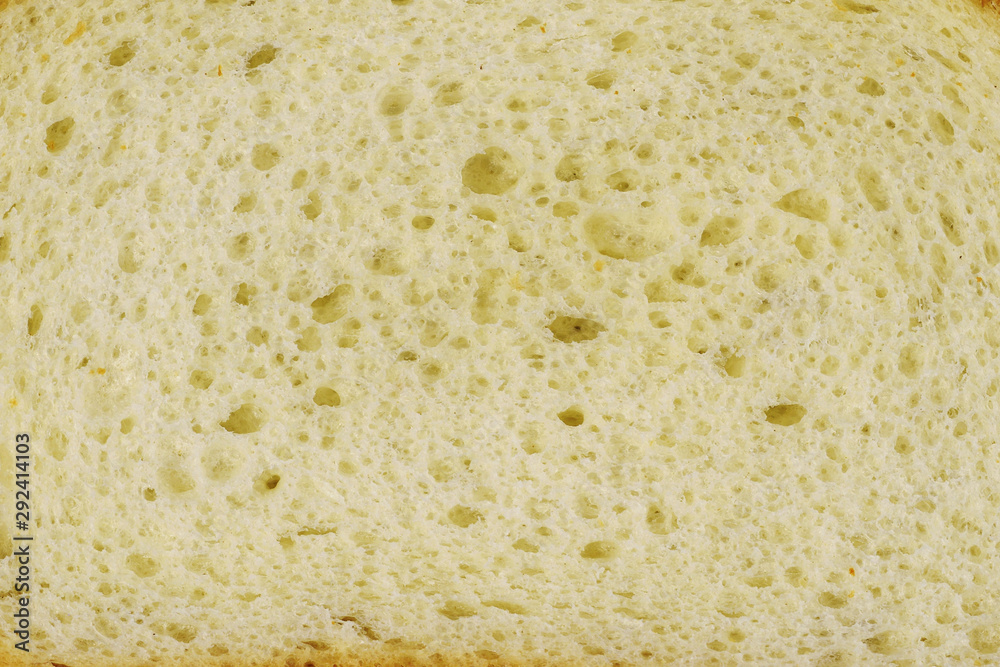 Bread texture. Long loaf piece. Closeup