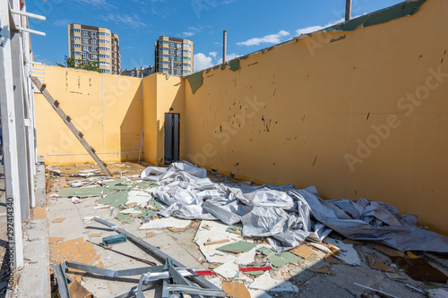 Dismantling the building, walls, lack of roof and construction debris