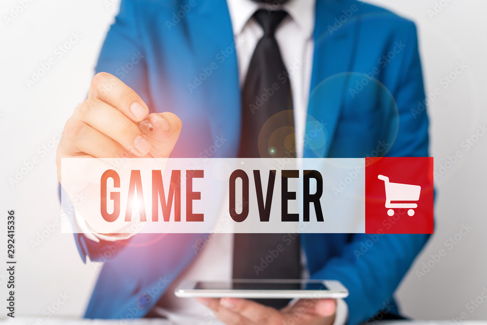 Word writing text Game Over. Business photo showcasing A situation in a particular sport that reach his finals or ending Businessman pointing with pen in empty copy space