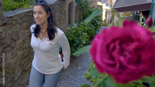 white woman and rose flower rack focus show in vogogna italy photo