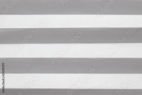 Pleated white sheet of paper. Horizontal lines