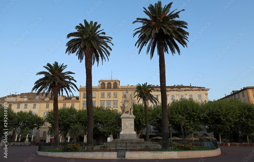View of the Place Saint-Nicolas square in Bastia, Corsica, France, highlighting the old statue of Napoleon Bonaparte as a roman emperor, sculpted on 1813. Corsica island.