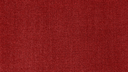 Dark red woven fabric texture background. Closeup