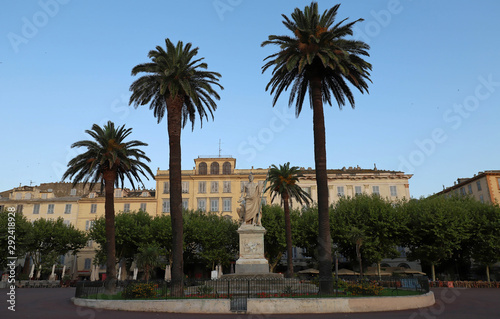View of the Place Saint-Nicolas square in Bastia, Corsica, France, highlighting the old statue of Napoleon Bonaparte as a roman emperor, sculpted on 1813. Corsica island. © kovalenkovpetr