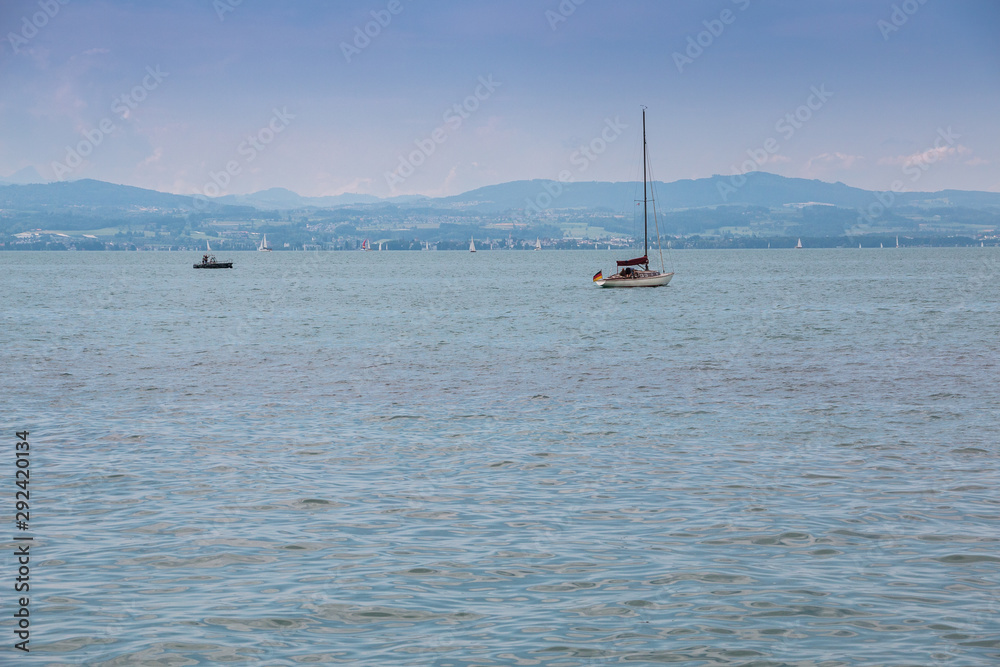 Sailboats with white sails on the lake