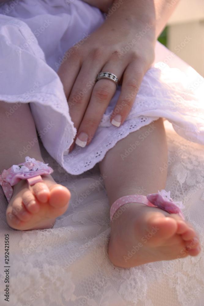 newborn feet at christening newborn feet at christening