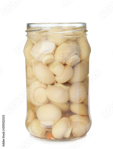 Glass jar with pickled mushrooms isolated on white
