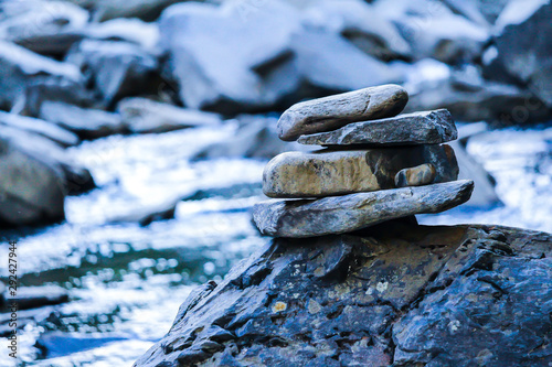 A variety of stones / Inukshuk of Canada beside the creek, Gorge park, Coaticook, Quebec, Canada